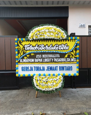 Papan Bunga Duka di Dow